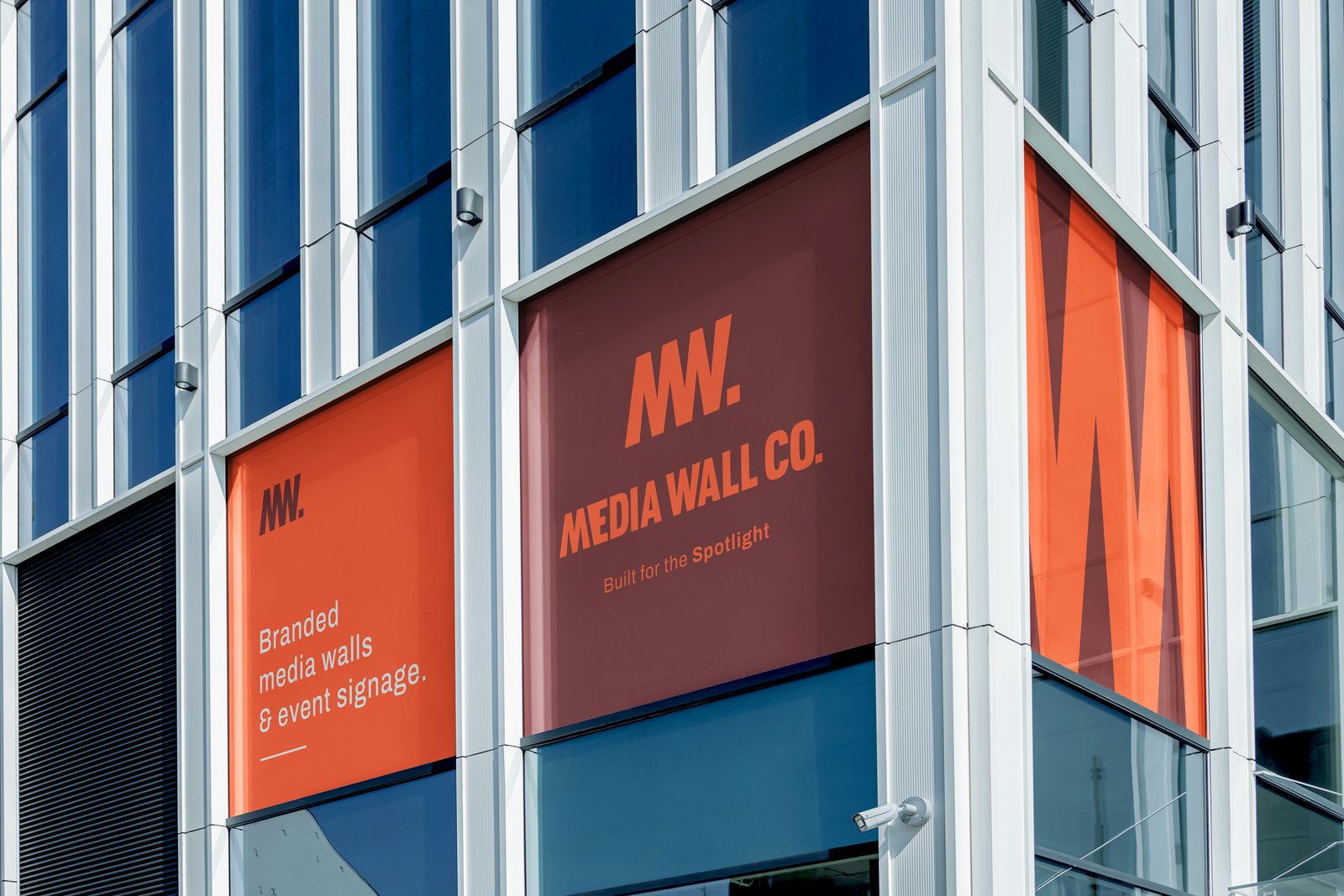 Branded media wall installed on a building facade